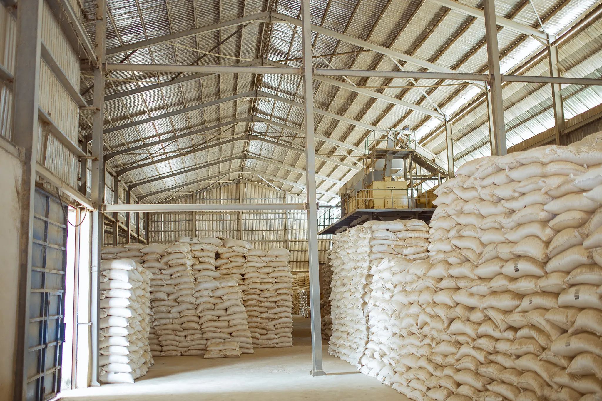 Sacks of paddy stacked in the Umza paddy store
